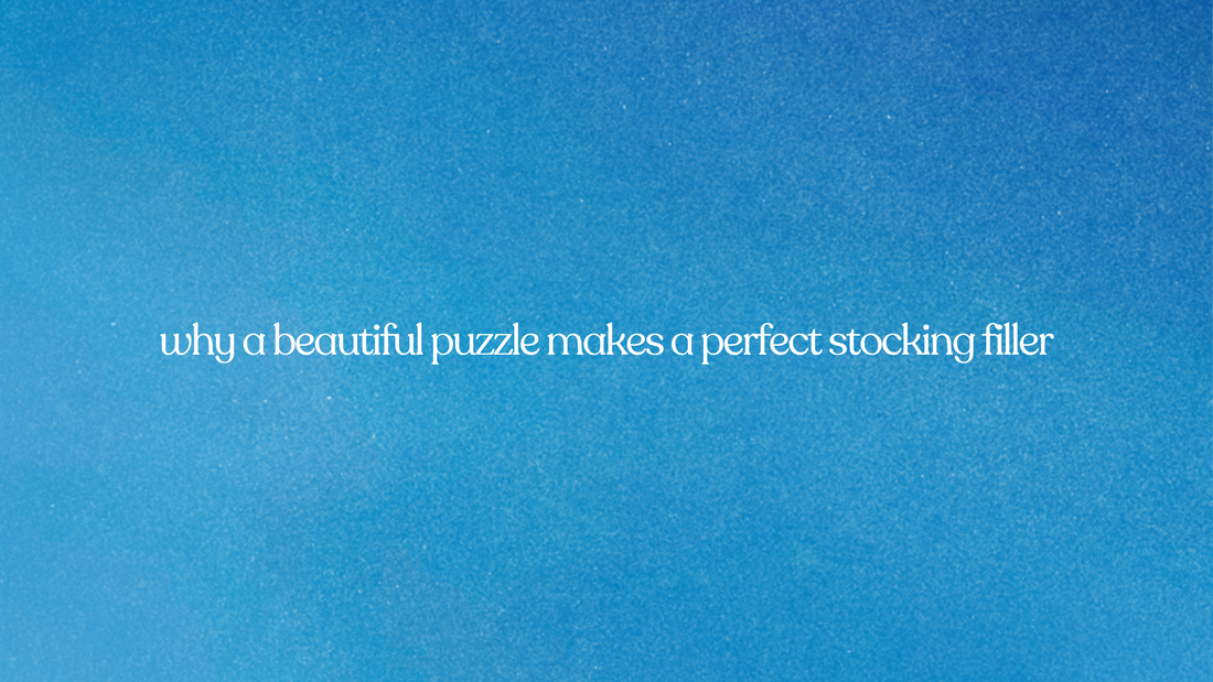 Text overlay on a bright, grainy blue background reads: "why a beautiful puzzle makes a perfect stocking filler."