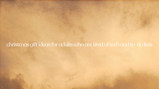 Text over a blurry, warm, golden-brown background reads: christmas gift ideas for adults who are tired of tech and to-do lists.
